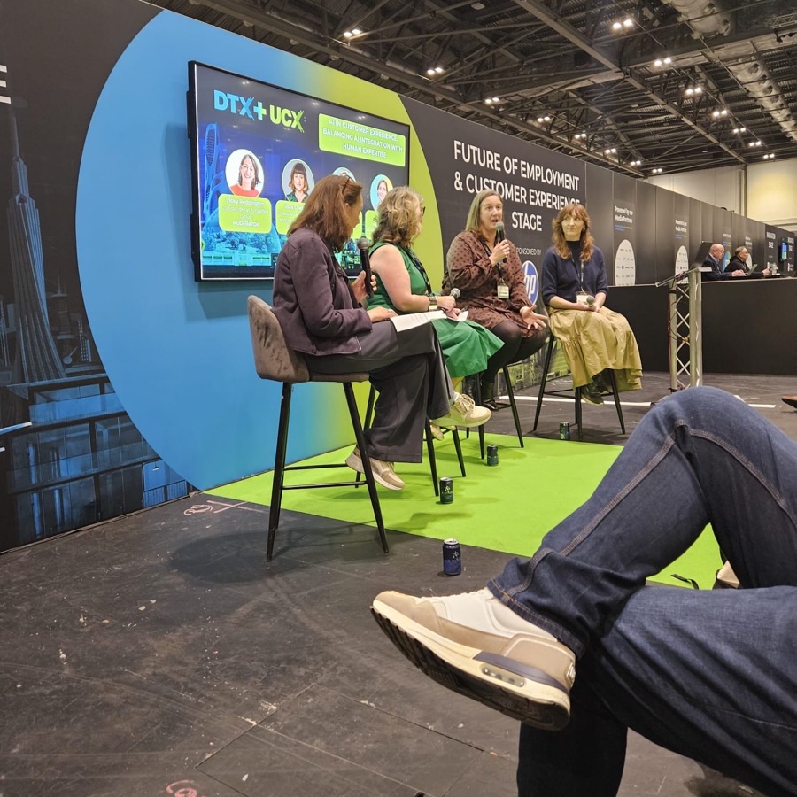 Four panellists in conversation on the Future of Employment and Customer Experience stage at DTX + UCX